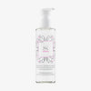 Transparente Flasche des Skintegra Atomic Reinigungsprodukts mit Pumpspender, verziert mit rosa-schwarzem Mandala-Design, 200 ml Inhalt.