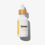 Weiße Flasche 100 % reines Arganöl von Timeless Skincare mit Holzdeckel und Pipette vor weißem Hintergrund. 30 ml.