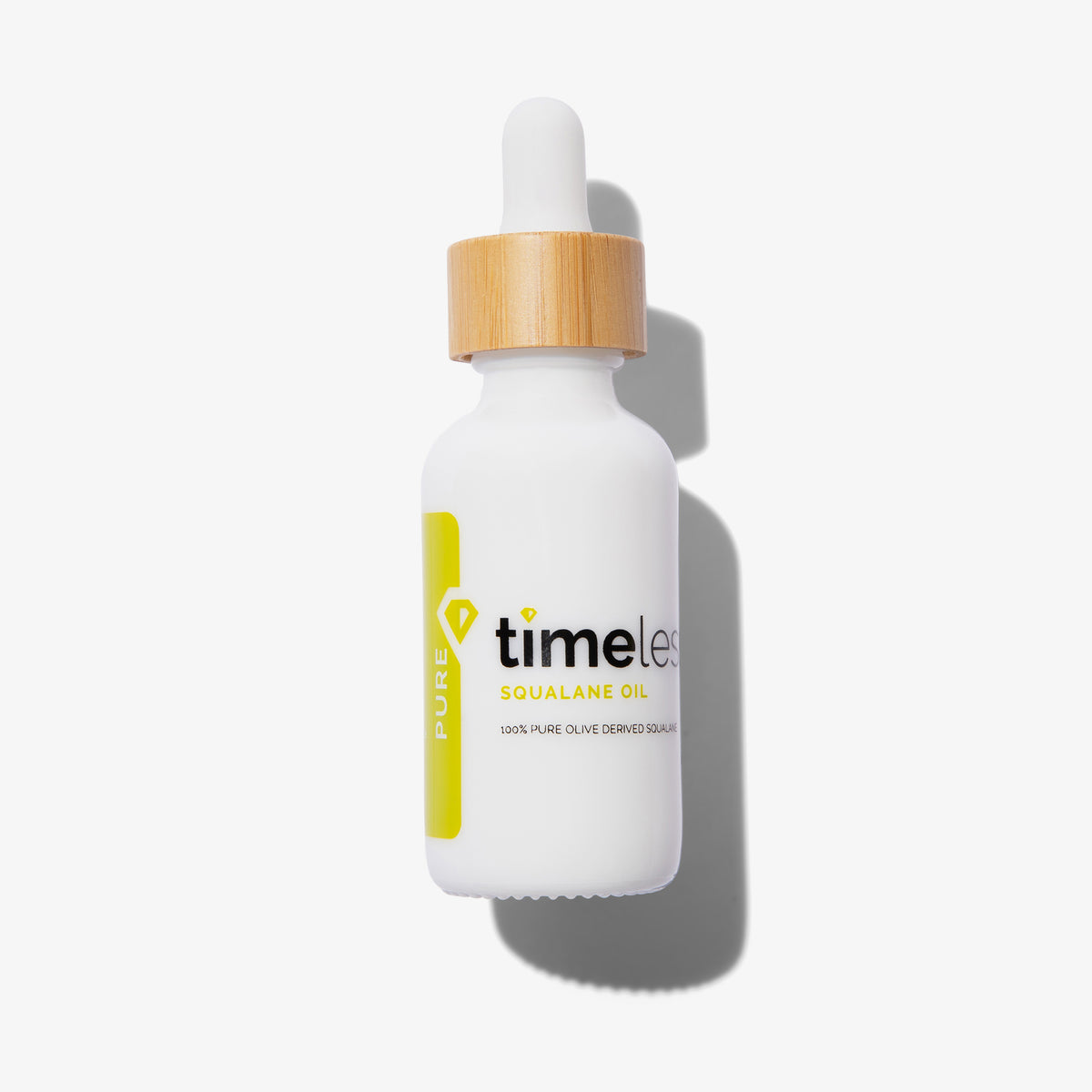 Timeless Skin Care Squalane Oil in einer weißen 30 ml Pipettenflasche mit gelbem Aufdruck und Holzverschluss vor weißem Hintergrund.