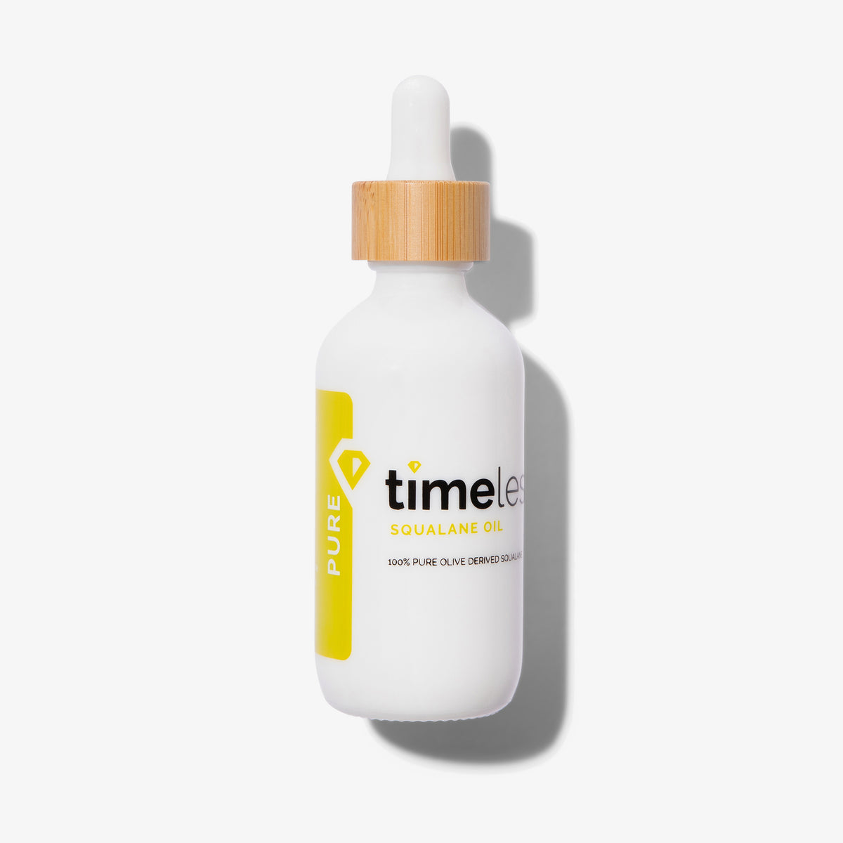 Timeless Skin Care Squalane Oil in einer weißen 60 ml Pipettenflasche mit gelbem Aufdruck und Verschluss in Holzoptik vor weißem Hintergrund.