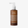 Braune Flasche mit weißer Pumpe und der Aufschrift „Hair Density Scalp Treatment“ von Transparent Lab, auf der die Liste der Inhaltsstoffe zu sehen ist.