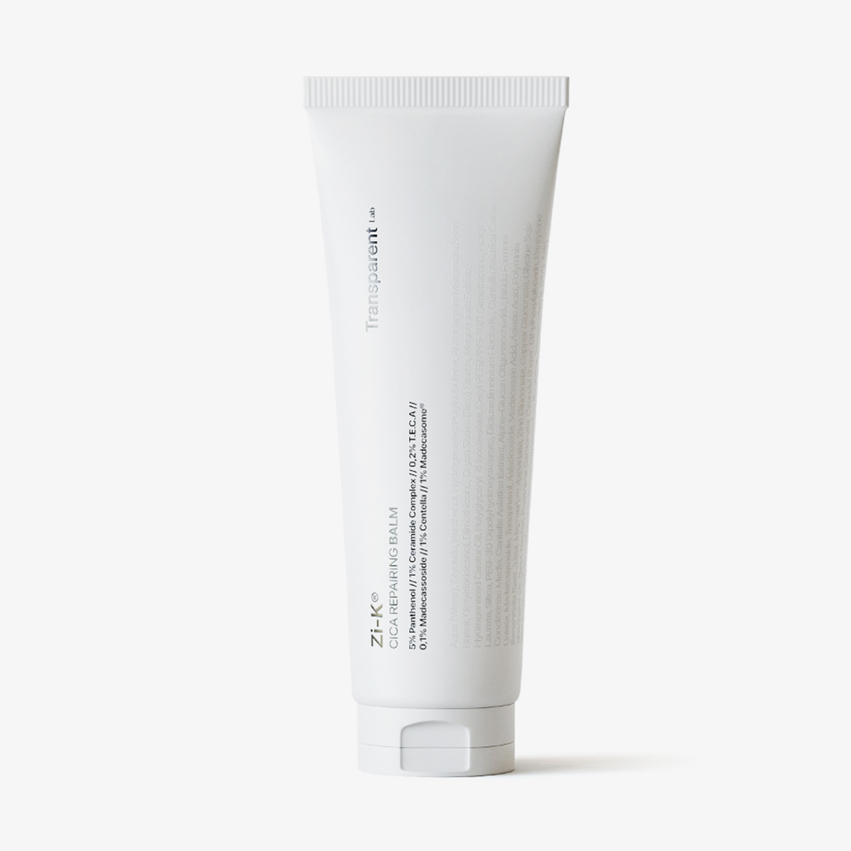Eine weiße Tube des Zi-K® Cica Repairing Balm von Transparent Lab steht aufrecht auf einem schlichten weißen Hintergrund.