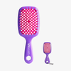 UNbrush und Super-Mini-Set Neon Purple mit einer Entwirrbürste und einer passenden Mini-Bürste mit Schlüsselanhänger.