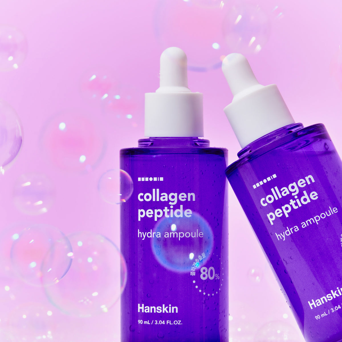 Vor einem rosa Hintergrund mit Blasen werden zwei violette Collagen Peptide Hydra Ampoule-Flaschen präsentiert.