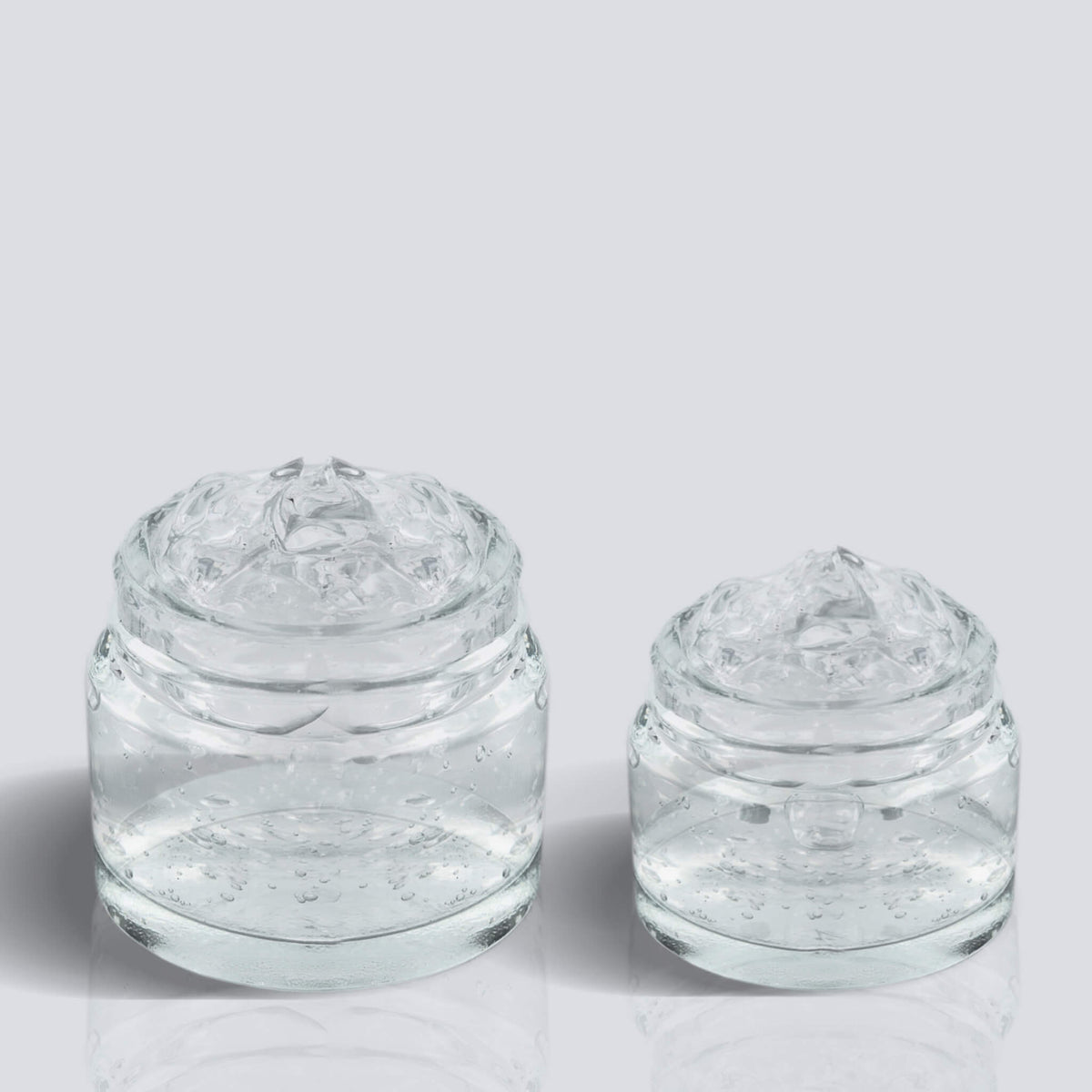 Zwei Mini-Fix-Potions in unterschiedlichen Grüßen mit strukturiertem transparentem Gel.