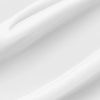 Nahaufnahme der glatten, cremeweißen Textur der Heartleaf 70 Daily Lotion mit sanften Rillen und glänzendem Finish.