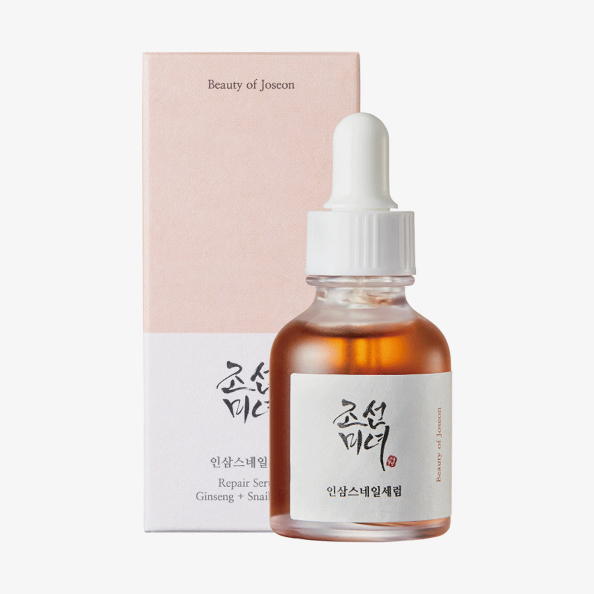 Tropfflasche und Verpackung des Revive Serum Ginseng+Snail Mucin vor weißem Hintergrund