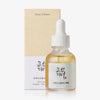 Tropfflasche und Verpackung des Glow Serum: Propolis+Niacinamid von Beauty of Joseon vor weißem Hintergrund
