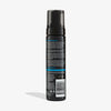 Rückseite der Self Tanning Foam Dark Flasche mit Etikett vor weißem Hintergrund
