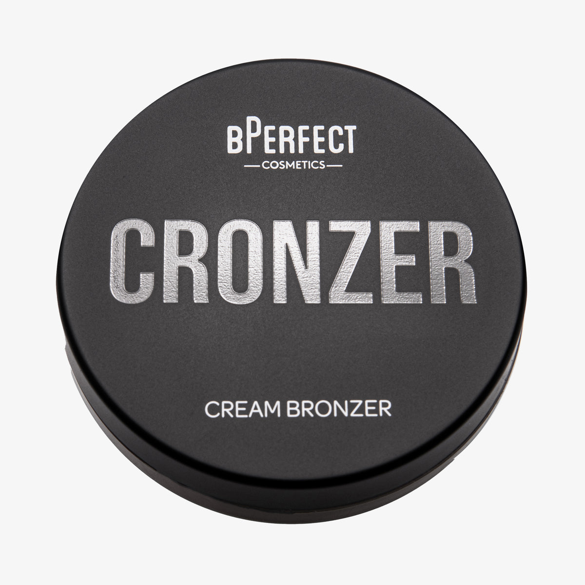 Runde schwarze Dose des BPerfect Cronzer Cream Bronzers mit silberner Aufschrift.