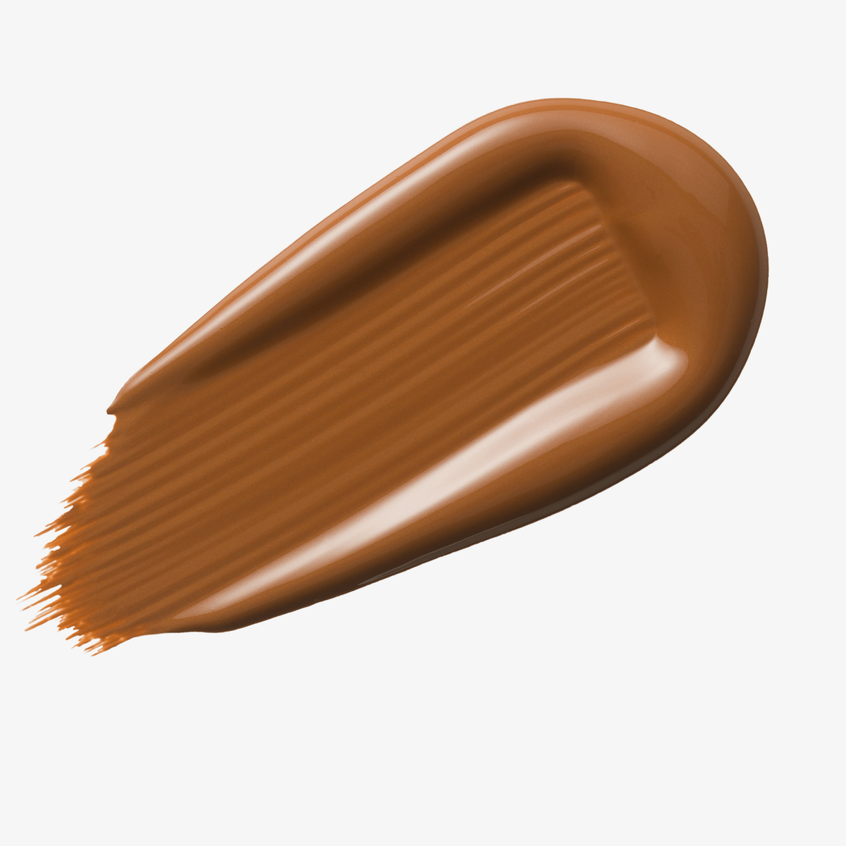 Warmes dunkelbraunes Farbmuster des Yummy Skin Serum Tint auf weißem Hintergrund.