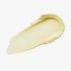 Ein beiger Farbstreifen Yummy Skin Blurring Balm Powder Shade Radiant auf weißem Hintergrund.