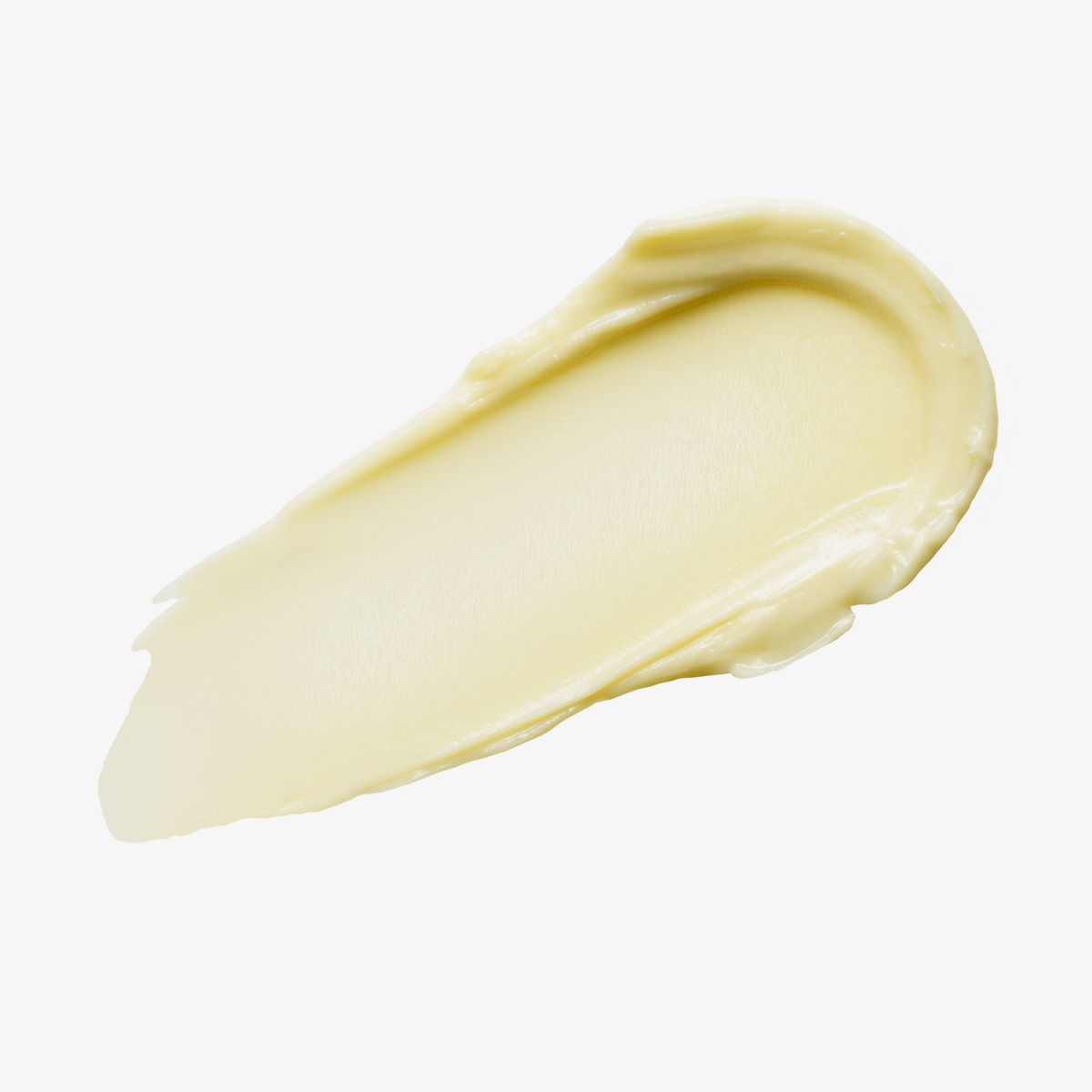 Ein beiger Farbstreifen Yummy Skin Blurring Balm Powder Shade Radiant auf weißem Hintergrund.