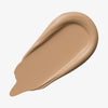 Ein beiger Farbstreifen Yummy Skin Lift & Flex Concealer 3 auf weißem Hintergrund.