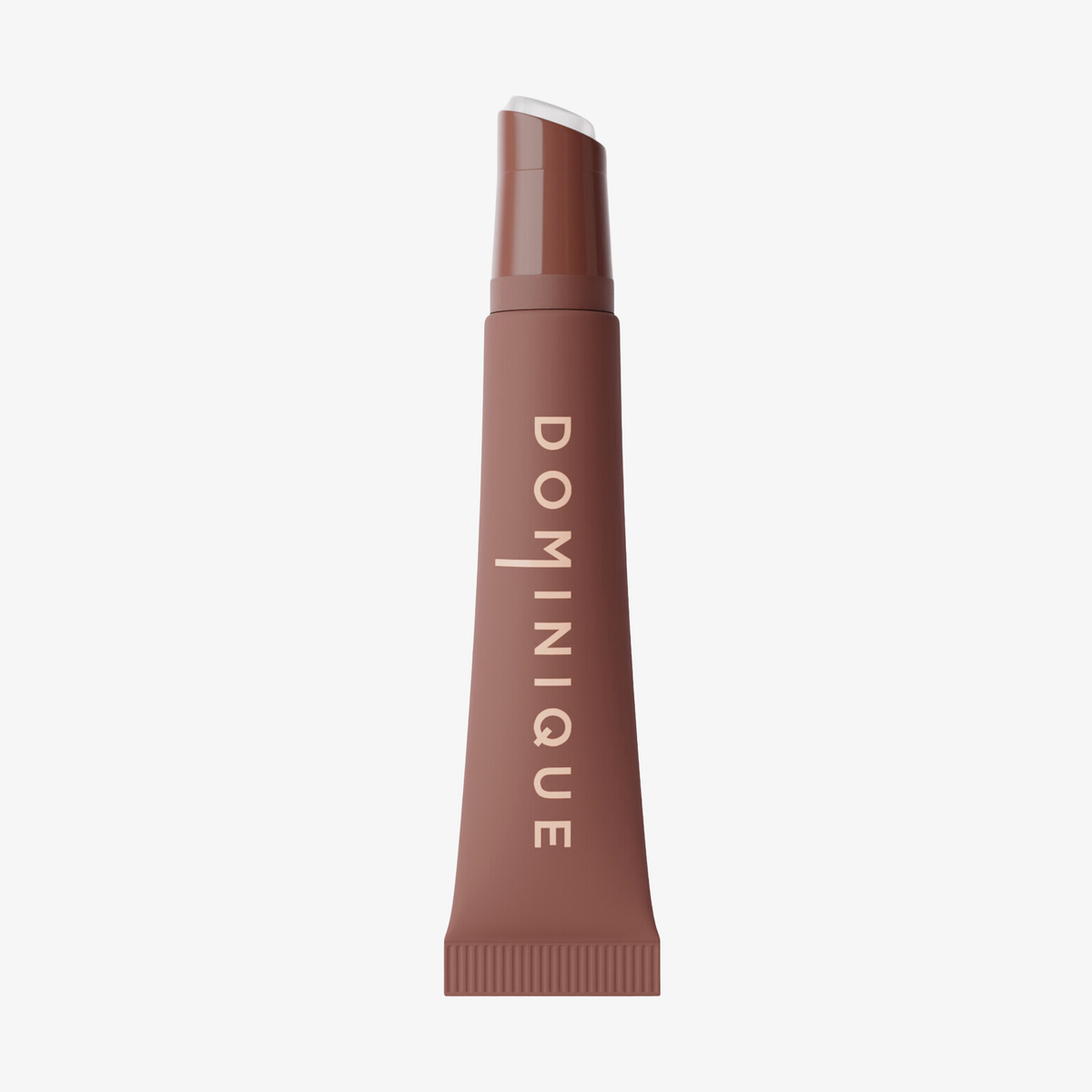 Eine braune Tube des Juicy Lip Balm von Dominique Cosmetics steht aufrecht vor einem weißen Hintergrund.
