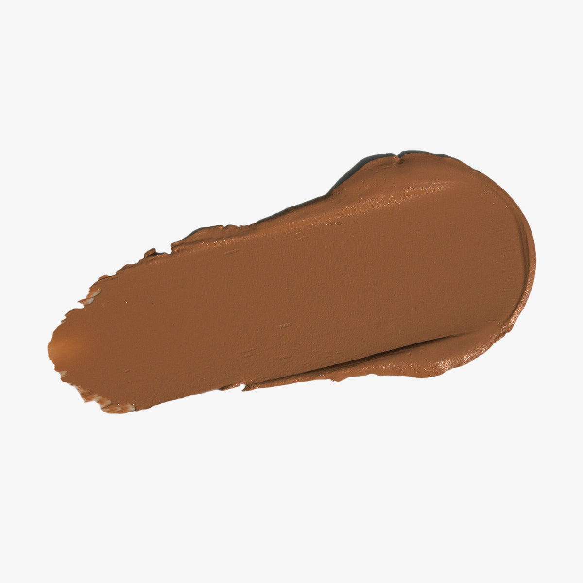 Ein sanfter Strich Silktone Cream Bronzer in Mittelbraun auf weißem Hintergrund.