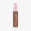 Transparente Flasche MAGIC FILTER Glow Booster im Farbton 70 Rich mit rosa Pumpe und dunkelbraunem Inhalt.