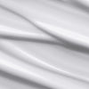 Nahaufnahme der cremig weißen Textur des HUSH Multi-Purpose Moisturiser mit sanften Lichtreflexen.