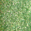 Nahaufnahme der Textur des des Opal Moonstone Loose Multichrome Eyeshadow Lucky Charm; ein grün schimmerndes Pigment.