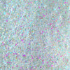 Nahaufnahme der Textur des des Opal Multichrome Loose Eyeshadow Velvet Dreams; ein türkis-pink schimmerndes Pigment.