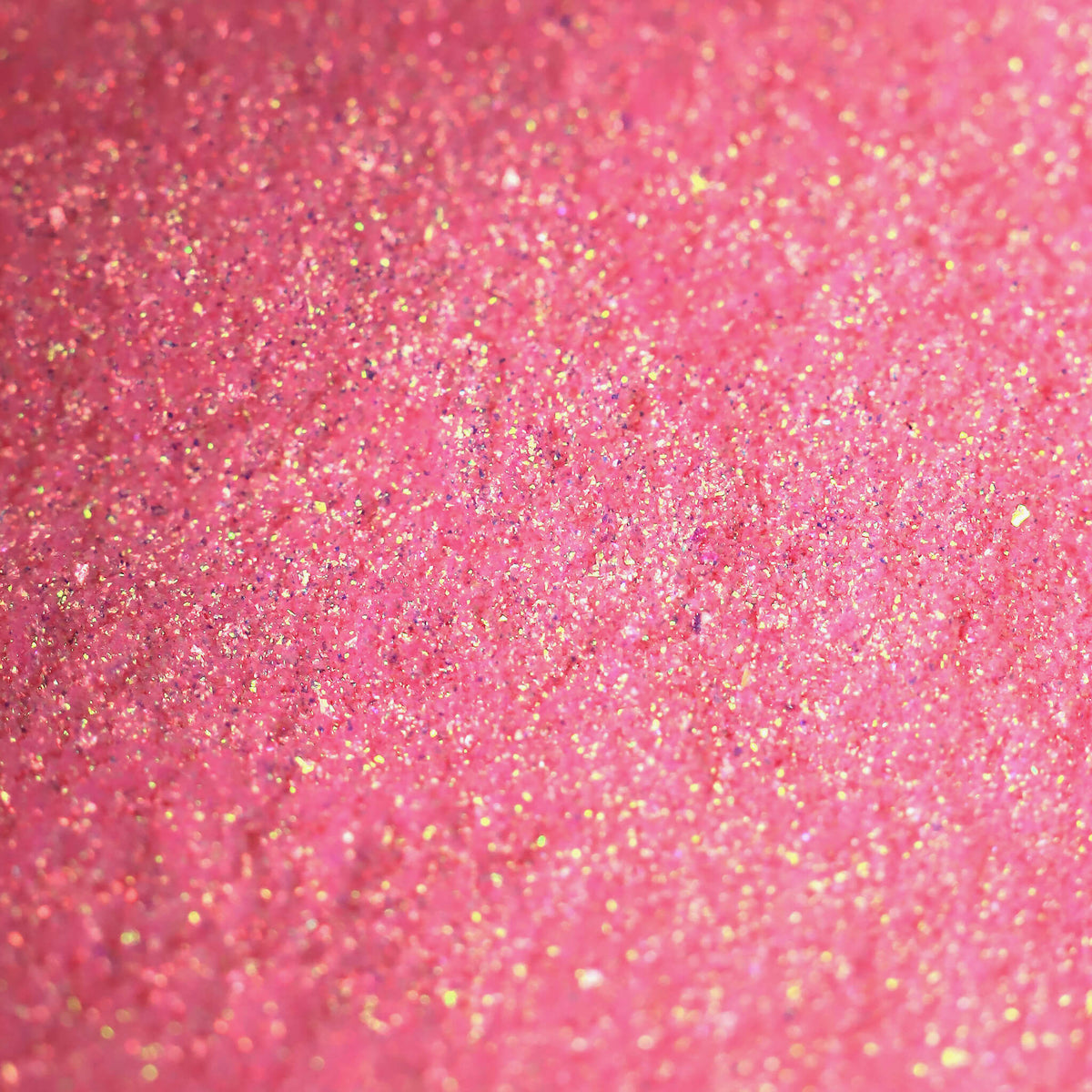 Nahaufnahme der Textur des Pastel Duochromes Loose Eyeshadow Ballerina Slipper; ein pink-gold schimmerndes Pigment.