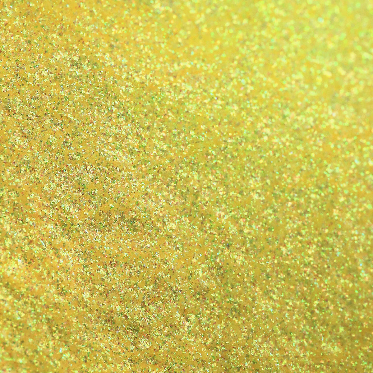Nahaufnahme der Textur des Pastel Duochromes Loose Eyeshadow Buttercup; ein neongelb schimmerndes Pigment.