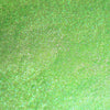Nahaufnahme der Textur des Pastel Duochromes Loose Eyeshadow Pom Pom; ein neongrün schimmerndes Pigment.