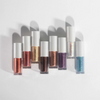 Neun schimmernde Sparkl-Lidschatten von LH Cosmetics in verschiedenen Farben, stehend nebeneinander auf weißem Hintergrund.
