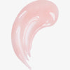 Ein glänzender hellrosa Swatch des Lip Glow Oil Balm Sugar mit kleinen Glitzerpartikeln auf weißem Hintergrund