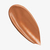 Glänzender warmbrauner Farbstreifen des Lumene NATURAL GLOW Skin Tone Perfector Perfect Tan.