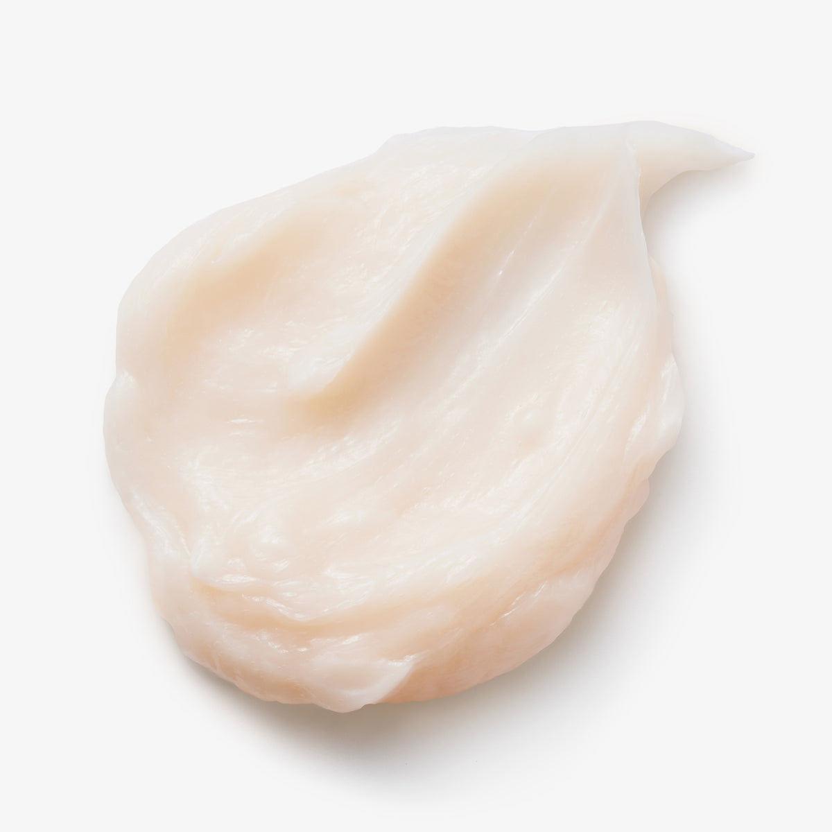 Ein Klecks der cremigen, weißen Booster Masque Head & Heal von maria nila auf weißem Hintergrund.