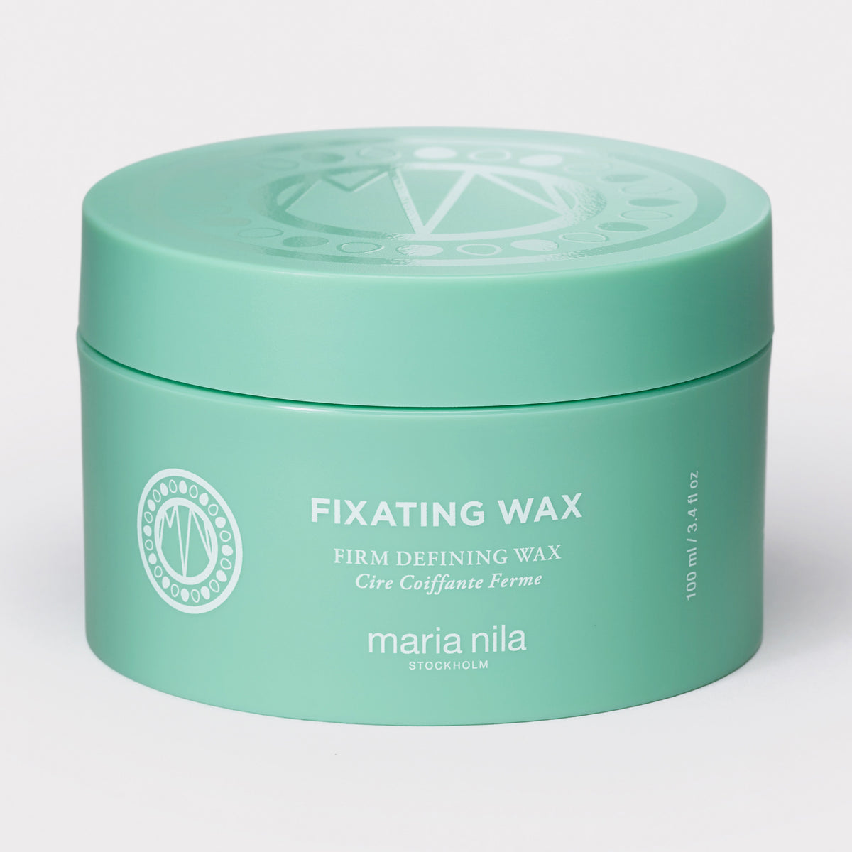 Mintgrüner Tiegel maria nila Fixating Wax dargestellt auf weißem Hintergrund.