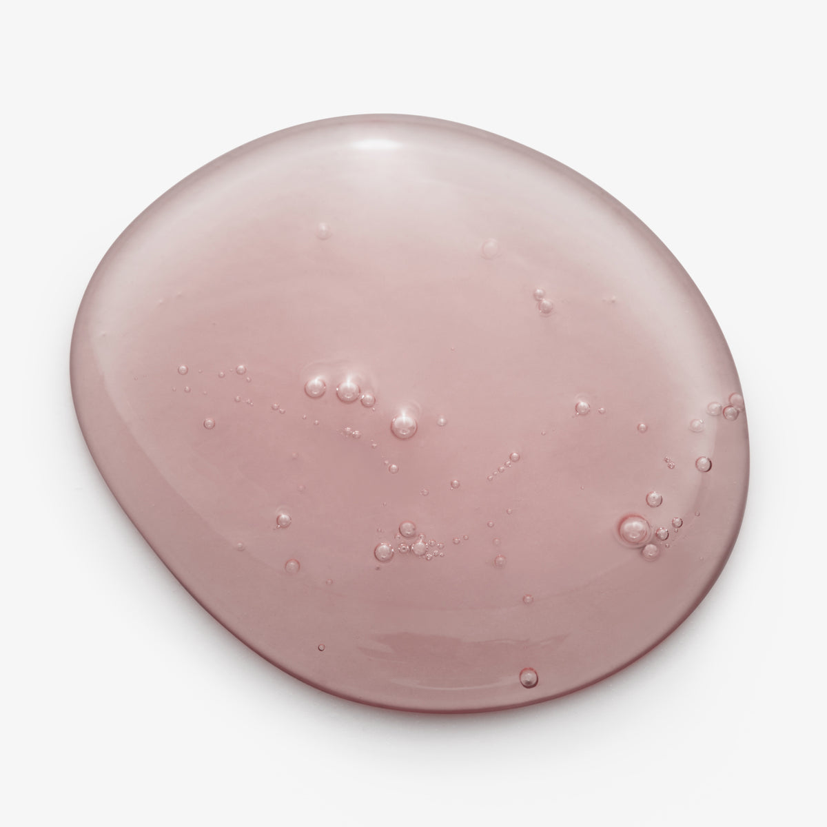 Ein rosafarbener, durchscheinender Klecks des maria nila Pure Volume Shampoo auf weißem Hintergrund.