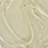 Nahaufnahme des Mario Badescu Anti Acne Serum, eine cremige, glatte und glänzende beigefarbene Textur.