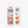 Viper Delicious Lip Kit mit vier farbenfrohen Lippenbalsambehältern mit passender Verpackung, vertikal angeordnet.