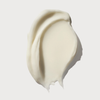 Ein cremeweißer Klecks der OLAPLEX Weightless Nourishing Mask auf weißem Grund.