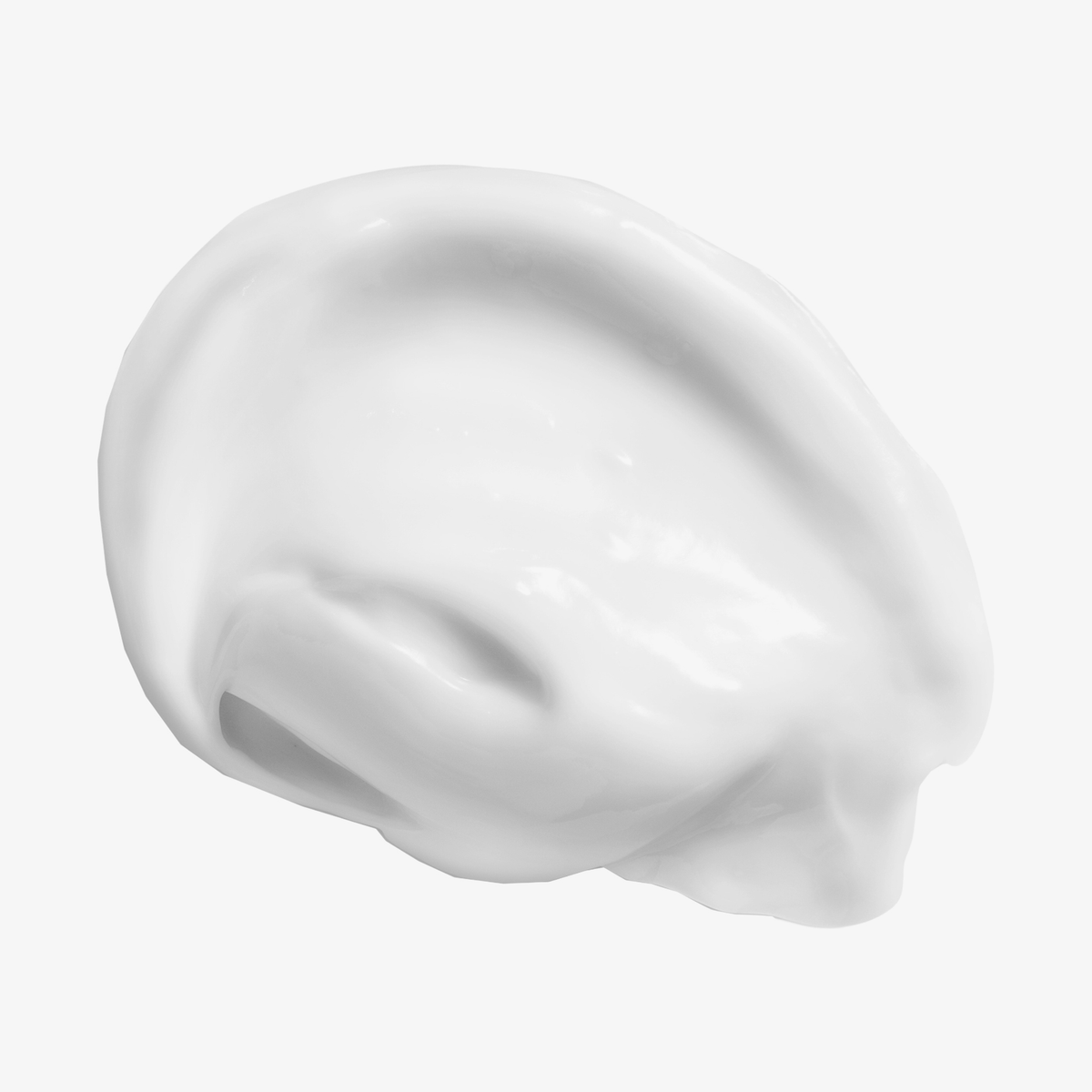Ein Klecks Philip Kingsley Elasticizer, eine geschmeidige und glänzende weiße Creme, abgebildet auf weißem Hintergrund.