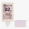 Eine geöffnete Flasche Bright Light Glow Drops Golden Star Dew mit einem rosa Deckel daneben.