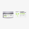Ein Tiegel und eine Schachtel mit der Haarstylingformel Scandinavian Biolabs Flexible Hybrid Clay auf weißem Hintergrund.