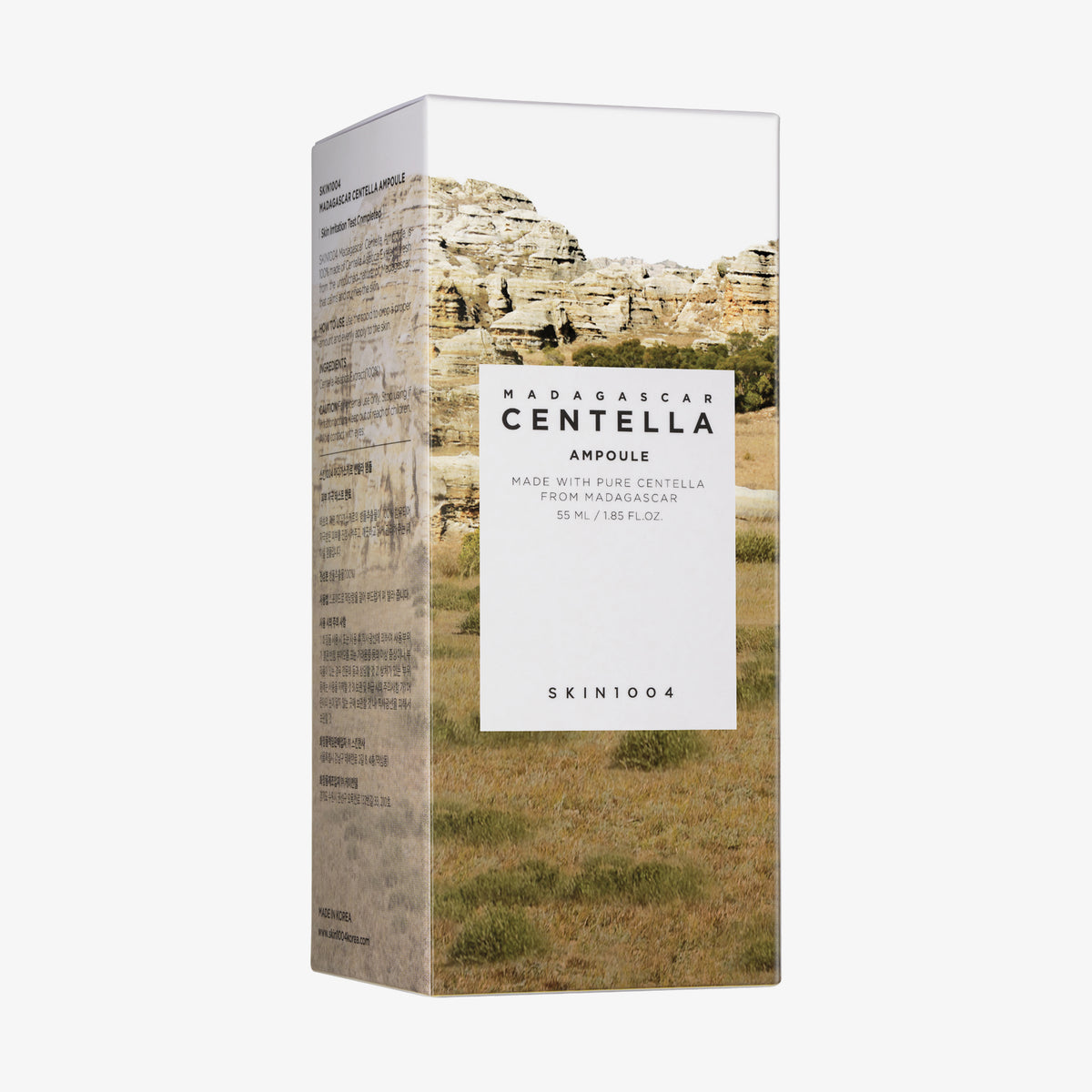 Eine Schachtel Madagascar Centella Ampoule mit dem Bild einer felsigen Landschaft auf der Verpackung.
