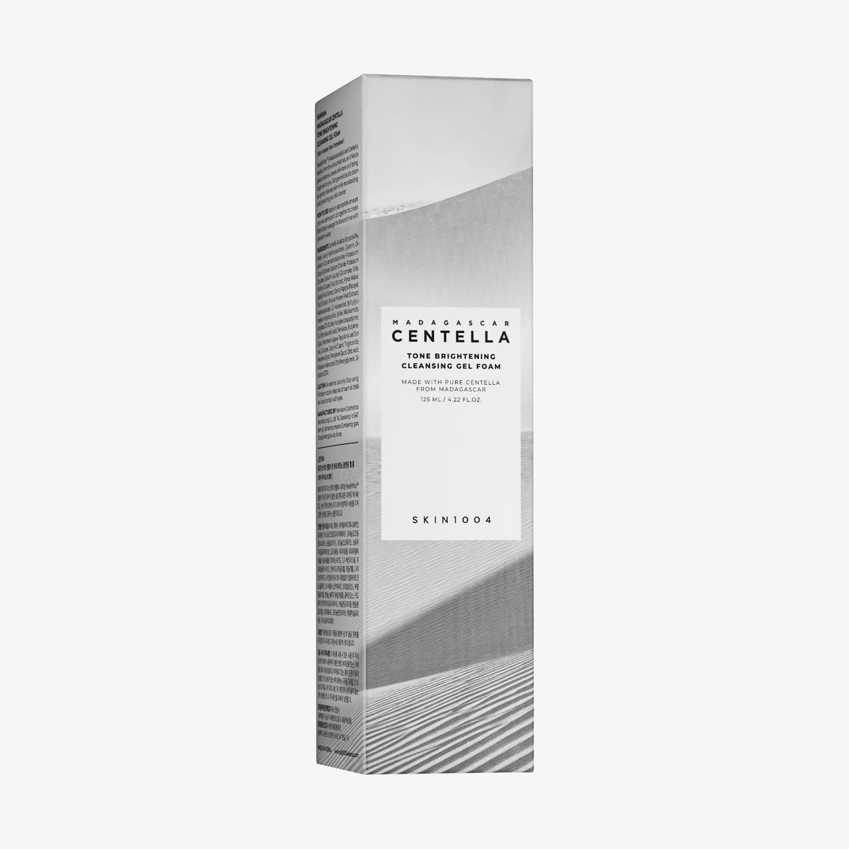 Hohe, rechteckige Schachtel mit Madagascar Centella Tone Brightening Cleansing Gel Foam im minimalistischen Design.