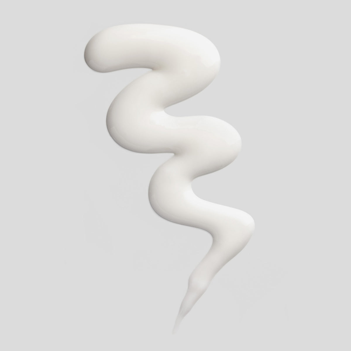 Nahaufnahme der weißen Hydra B-Creme auf hellgrauem Hintergrund.