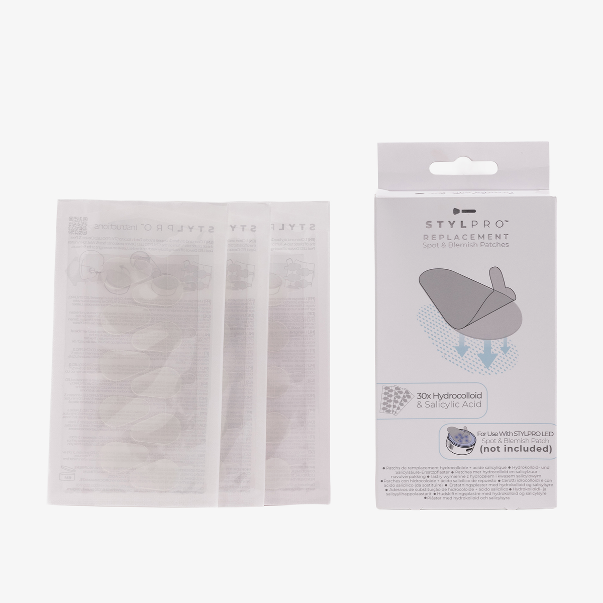 STYLPRO Replacement Spot Blemish Patches mit Schachtel und drei Paketen mit Pflasterblättern auf weißem Hintergrund.