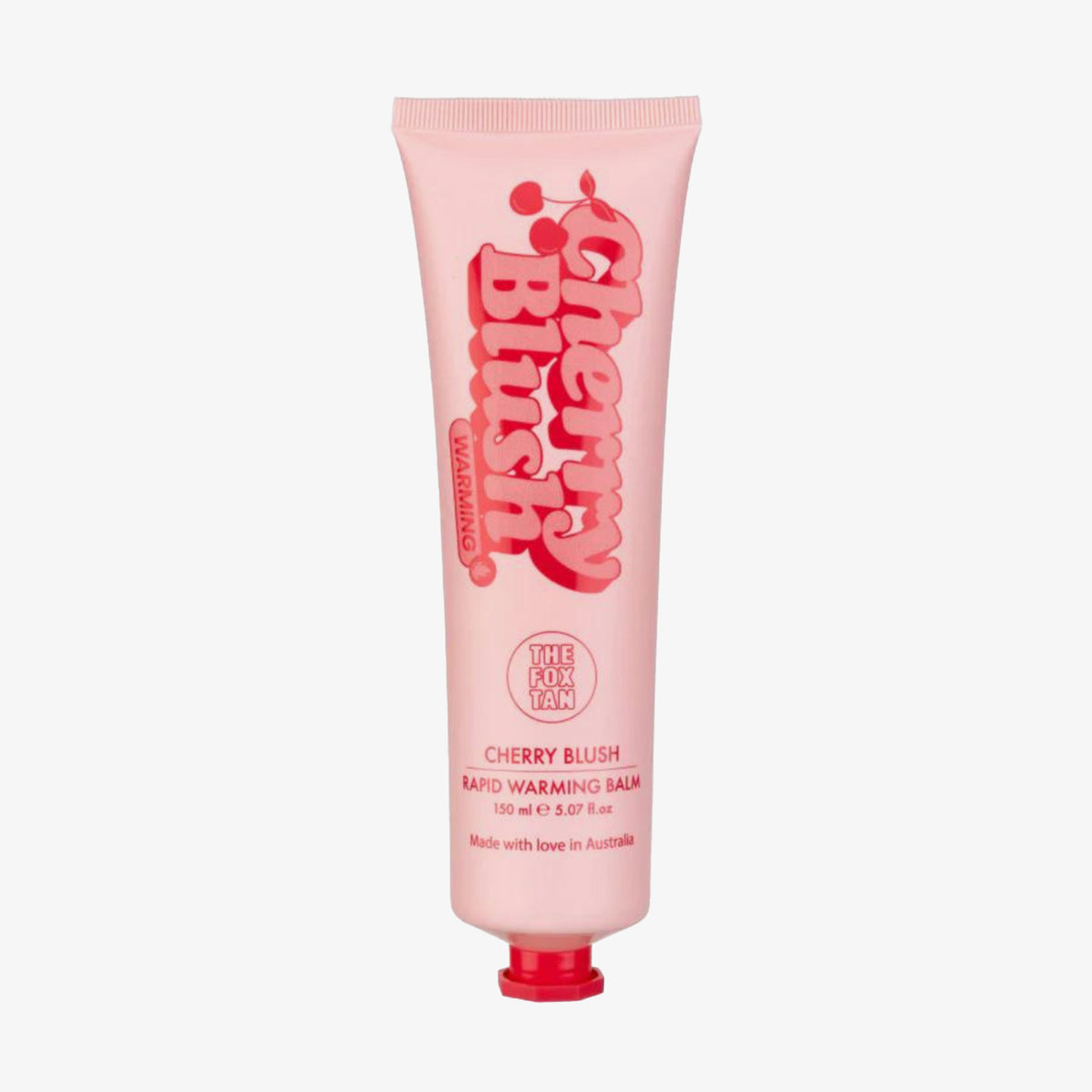 Rosa Tube des „Cherry Blush Rapid Warming Balm“ von The Fox Tan mit roten Schriftzügen und Kirschgrafik – hergestellt in Australien.