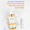 Eine Flasche 2 % BHA Anti Blackhead & Pore Firming Salicylic Acid Oil Control Toner auf Handtüchern, die seine Ölkontrolle und Vorteile für alle Hauttypen hervorhebt.