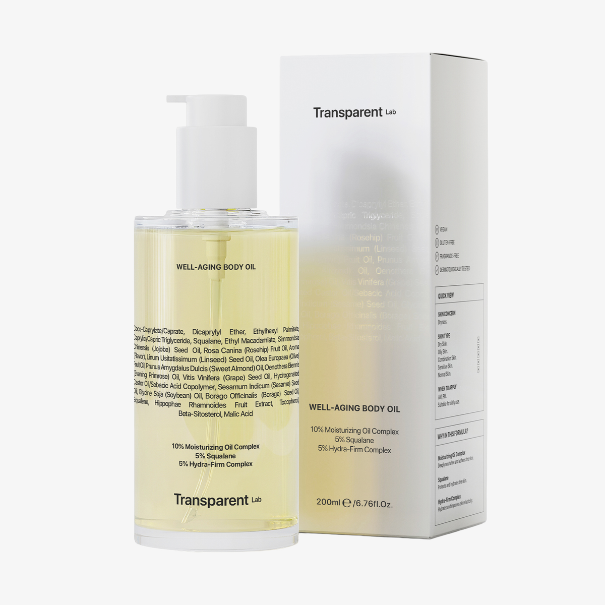 Eine 200-ml-Flasche Transparent Lab Well-Aging Body Oil neben der weißen Schachtel.