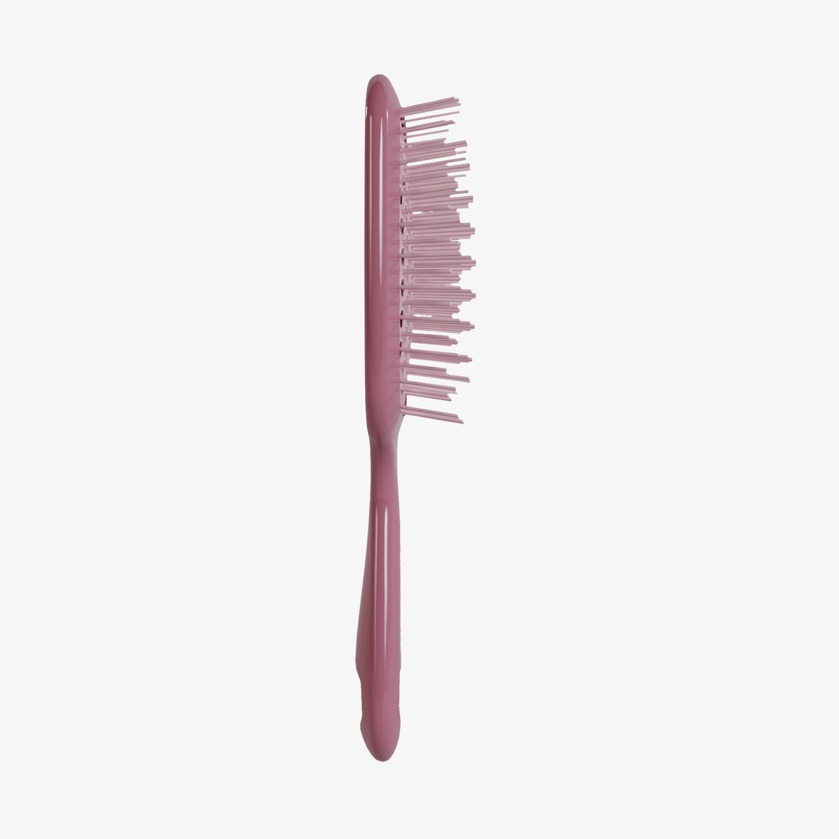 Eine UNbrush Detangling Hair Brush in Rosa mit fehlenden und gebogenen Borsten, aufrecht stehend auf weißem Hintergrund.