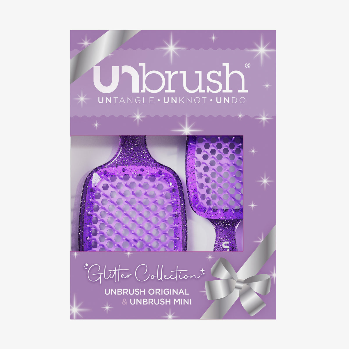 Das UNbrush Glitter Duo Set Amethyst Lavender von UNbrush wird in einer Geschenkbox mit silbernem Bandaufdruck geliefert.