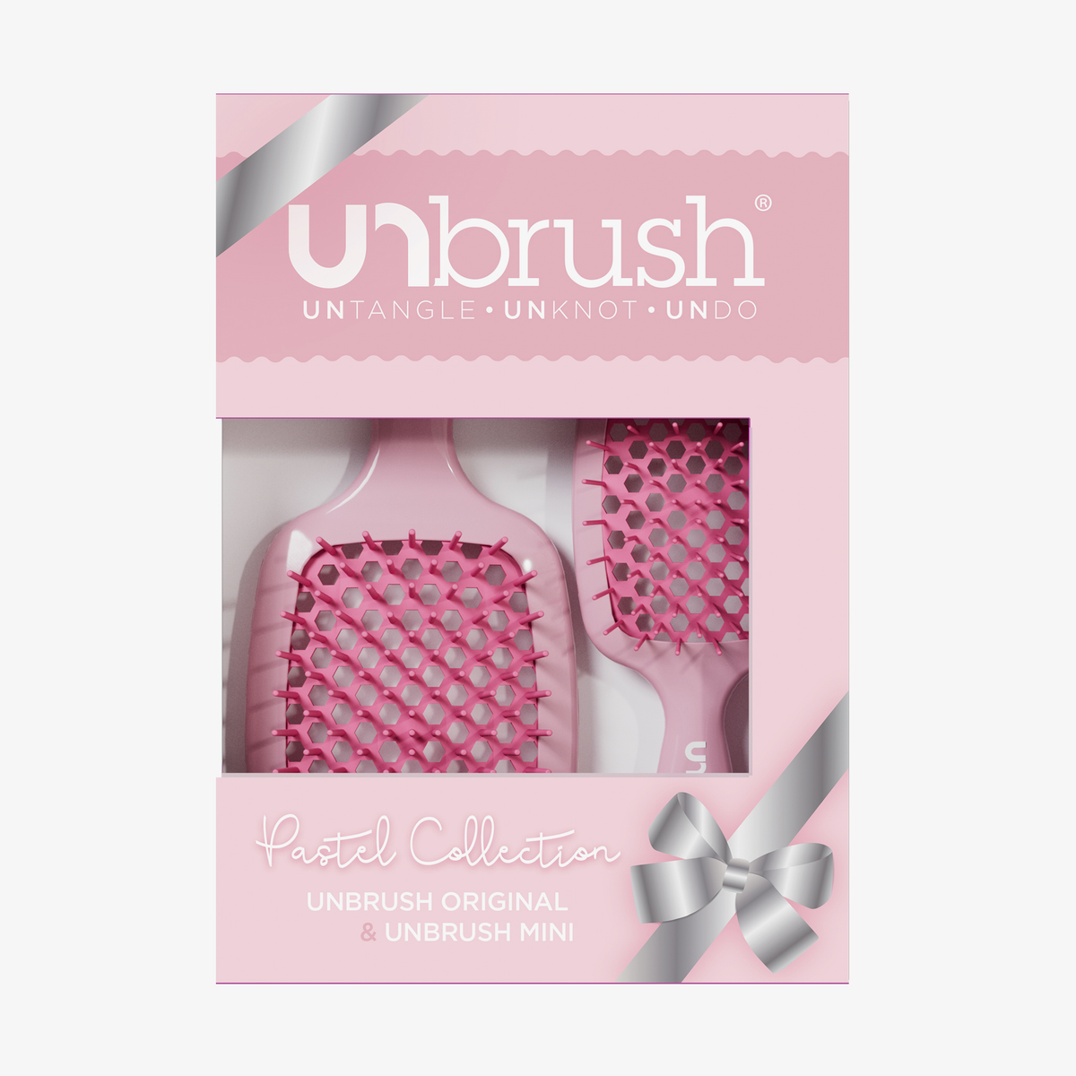 Das UNbrush Pastel Duo Set besteht aus zwei Pinseln in einer pastellfarbenen Verpackung mit einem silbernen Band und einem klaren Fenster.