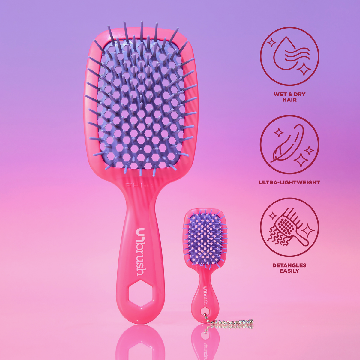 Haarbürsten der Serien UNbrush und Super Mini Set in Neon-Pink mit violetten Borsten, gekennzeichnet durch Nass-/Trocken-Symbole, leichtes Design und einfache Entwirrung.